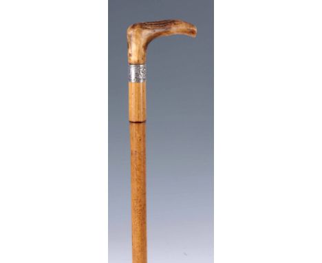 A LATE 19th CENTURY GENTLEMANS HORSE MEASURING WALKING STICK SIGNED ARNOLD & SONS, LONDON having a screw top stag horn handle