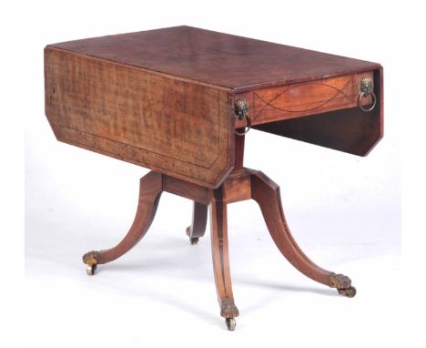 A GEORGE III EBONY LINED AND INLAID FALL LEAF SUPPER TABLE IN THE MANNER OF THOMAS HOPE with clipped corners and  frieze draw