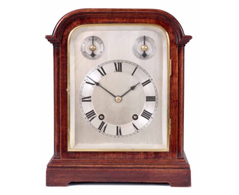 WINTERHALDER OF HOFMEIER. AN EARLY 20th CENTURY GERMAN QUARTER STRIKING MANTEL CLOCK the mahogany break arch case with brass 