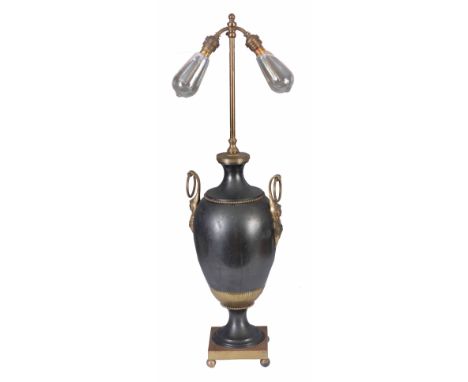 AN EARLY 20th CENTURY REGENCY STYLE ELECTRIC TABLE LAMP the rise and fall brass stem on bronzed vase shaped base on square br