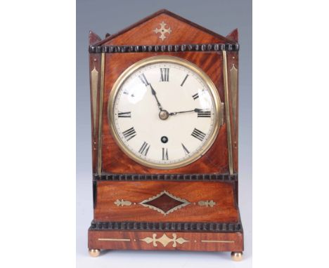 A REGENCY MAHOGANY AND BRASS INLAID MANTEL CLOCK the Egyptian style case having an architectual top enclosing a 5" convex pai