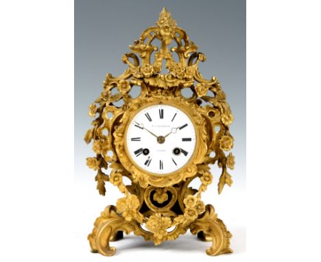 F.L. HAUSBURG, PARIS A 19th CENTURY FRENCH ORMOLU ROCOCO STYLE MANTEL CLOCK the foliate and scrollwork decorated case enclosi