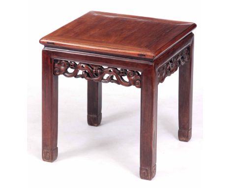 A 19TH CENTURY CHINESE HARDWOOD SQUARE OCCASIONAL TABLE with panelled top on square carved legs joined by open cut pierced sc