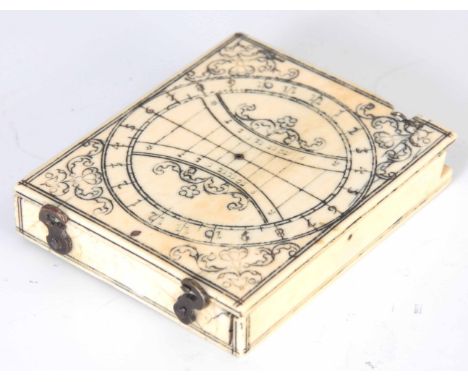 A RARE MID 17th CENTURY FRENCH DIEPPE IVORY MAGNETIC AZIMUTH DIAL having hinged lid with calibrated scales and scrollwork eng