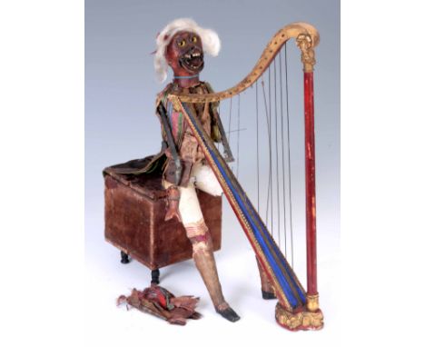 A MID 19th CENTURY FRENCH MONKEY HARPIST AUTOMATON MUSIC BOX in unrestored condition, the seated monkey, holding a gilt harp,