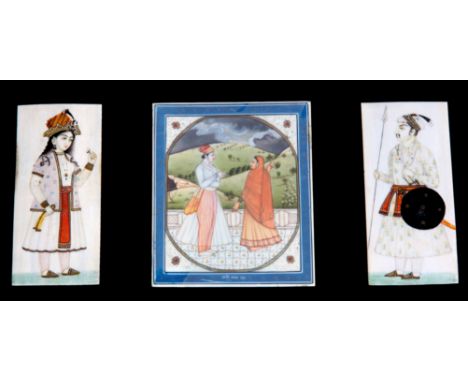 A SELECTION OF THREE 19th CENTURY PERSIAN PAINTED PANELS ON IVORY a pair depicting a man and woman in ceremonial dress and a 