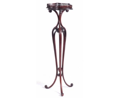 A LATE 19th CENTURY CHIPPENDALE STYLE MAHOGANY TORCHERE having slender scrolled tripod base leading to a pierced shaped galle