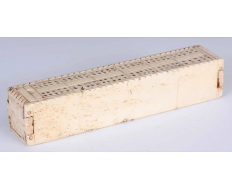 AN EARLY 19th CENTURY BONE PRISONER OF WAR DOMINO SET the sliding lid with cribbage board opening to reveal a set of bone dom