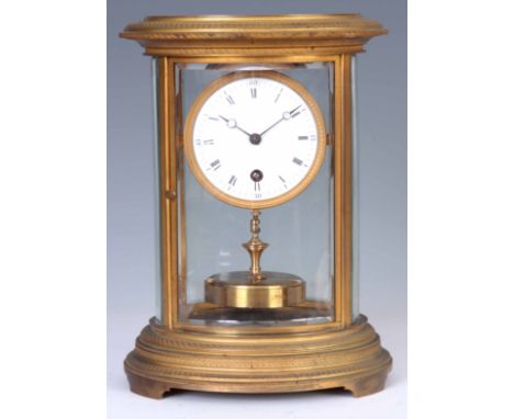 CLAUDE GRIVOLAS. AN EARLY 20th CENTURY BRASS OVAL CASED FOUR GLASS 400 DAY MANTEL CLOCK the gilt case with engine turned deco