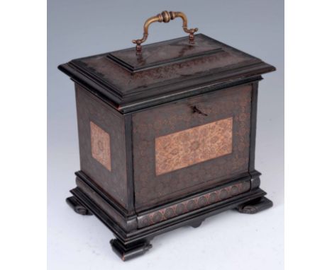 A 19TH ANGLO INDIAN COPPER AND PEWTER TABLE CABINET with caddy top and fitted brass swan-neck carrying handle, fall down fron