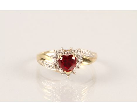 9 carat gold ring with a set heart shaped created ruby, yellow gold shank
