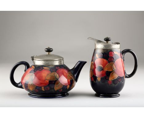 Moorcroft pottery four piece tea service, with pewter covers and mounts decorated with the pomegranate pattern signed in blue