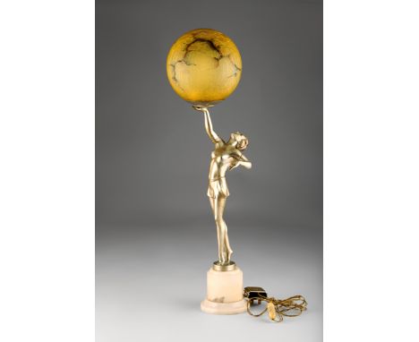 Silvered Spelter Art Deco figure table lamp, a dancing girl outstretched on her toes holding the globular glass light shade, 