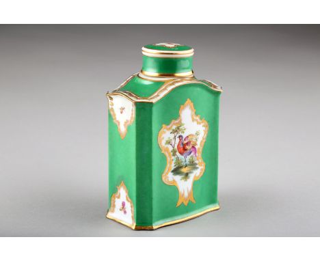 Continental ceramic tea caddy with cover, apple green ground with a hand painted fancy bird, gilt enrichments, 13cm high 