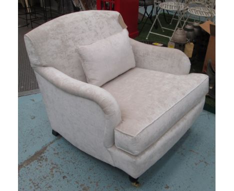 ARMCHAIR, Howard style in neutral fabric on turned castor supports, 87cm W with cushion.