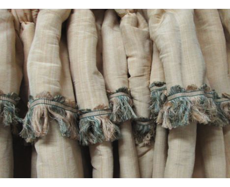 CURTAINS, a pair, in a light sand coloured woven silk effect fabric with tasseled upper border, lined and interlined, 90cm x 
