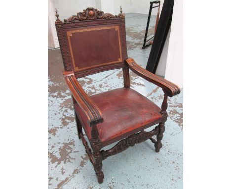 ARMCHAIR, early 20th century walnut and brass mounted with leather seat and back on an ornate carved frame, 67cm W. 