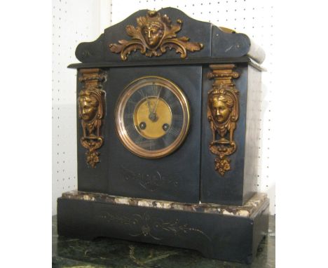 ARCHITECTURAL MANTEL CLOCK, Victorian black slate and marble, with classical figure head mounts, wire gong striking movement,