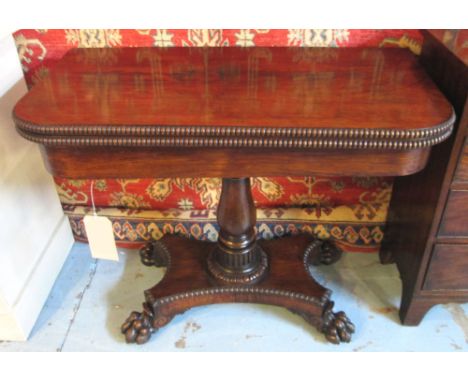 CARD TABLE, Regency rosewood with fold-over baize lined top, column and carved quadraped supports. 