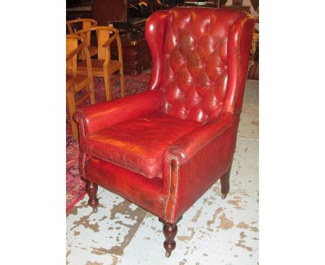 WING ARMCHAIR, Victorian mahogany in old buttoned and close nailed red leather with cushion seat, 76cm W. 