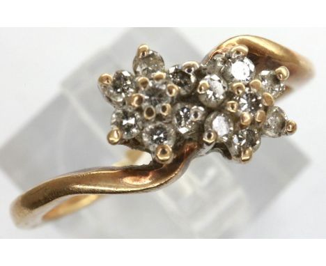 9ct gold diamond set twin flower ring, size Q, 2.5g. P&amp;P Group 1 (£14+VAT for the first lot and £1+VAT for subsequent lot