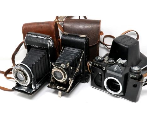 Three cameras, two vintage folding cameras and one Zenith, all with cases. P&amp;P Group 2 (£18+VAT for the first lot and £3+