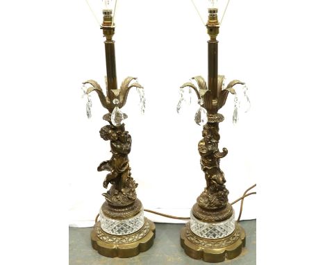 Pair of brass and crystal figural lamps featuring cherubs, H: 60 cm, no visible damages/restoration, no chips to crystal on t