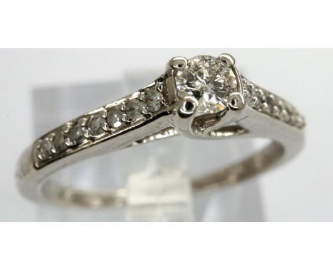 9ct white gold diamond set ring with diamond chip shoulders, size K, 2.2g. P&amp;P Group 1 (£14+VAT for the first lot and £1+