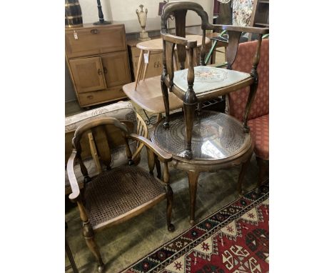 A 1920's circular caned beech occasional table, diameter 76cm, together with a pair of elbow chairs, one with a later tapestr