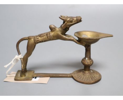 An Indian brass oil lamp