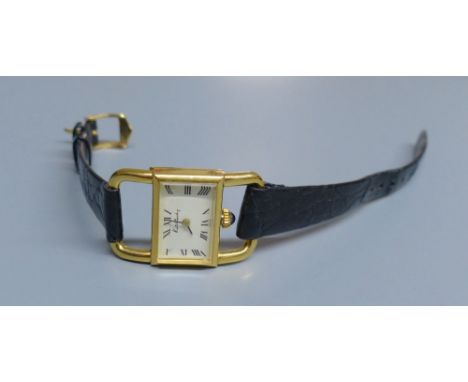 A lady's 18ct gold Kutchinsky manual wind rectangular dial wrist watch, with Ebel movement, on associated leather strap, case