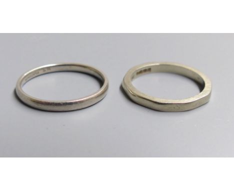 An 18ct gold decagonal wedding band (worn), size K, 2.9 grams and a white metal wedding band stamped 'Platinum', size M, 2.7 