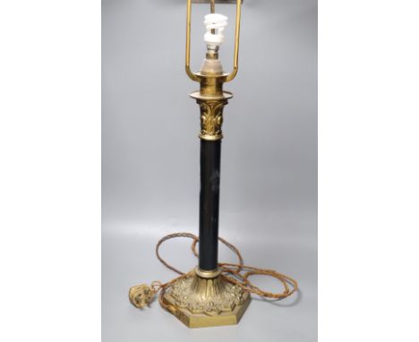 A brass and ebonised 'patented' table lamp