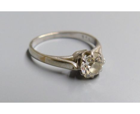 A white metal and old mine cut solitaire diamond ring, size M, gross 2.6 grams, the stone weighing approx. 0.60ct.CONDITION: 