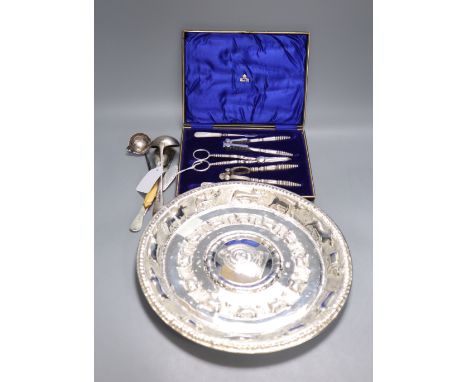 An Eastern embossed plated tray, a cased plated nut and grape set, a plated coffee pot, a silver sauce ladle and sundries