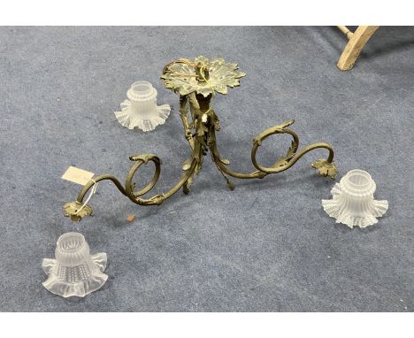 A cast brass three branch ceiling light with glass shades