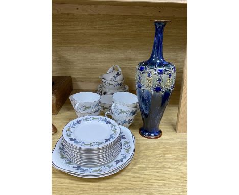 A Royal Doulton 'Burgundy' pattern tea cups and saucers and a Doulton stoneware vase