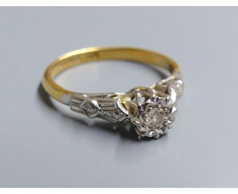 A 1960's 18ct gold and illusion set solitaire diamond ring, size J/K, gross 2.4 grams.