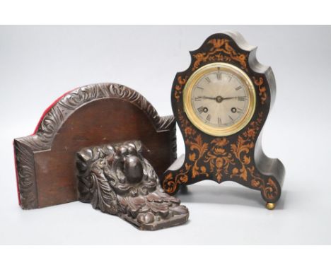 A 19th century marquetry inlaid mantel clock, height 23cm, together with a carved oak bracketCONDITION: The veneer has split 