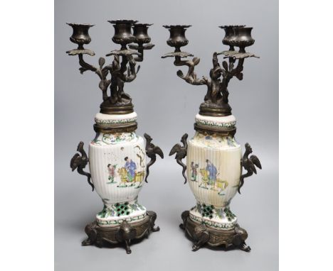 A pair of Chinese famille verte vases converted to candelabra, height 41cm