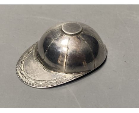 A George III engraved silver novelty caddy spoon, modelled as a jockey's cap, Josiah Snatt, London, 1810, 51mm.CONDITION: Sma