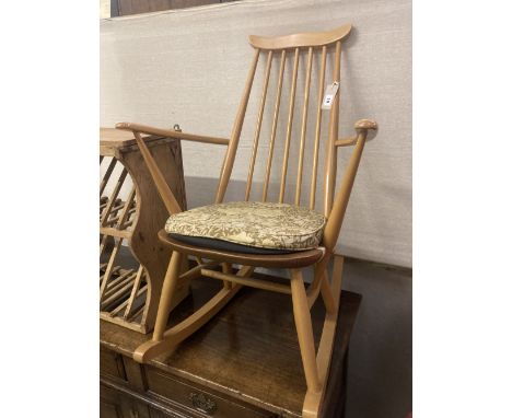 An Ercol stickback beech rocking chair