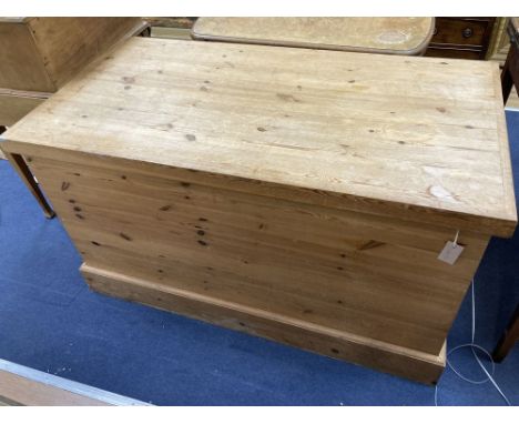 A large Victorian style pitch pine trunk, width 131cm depth 70cm height 74cm