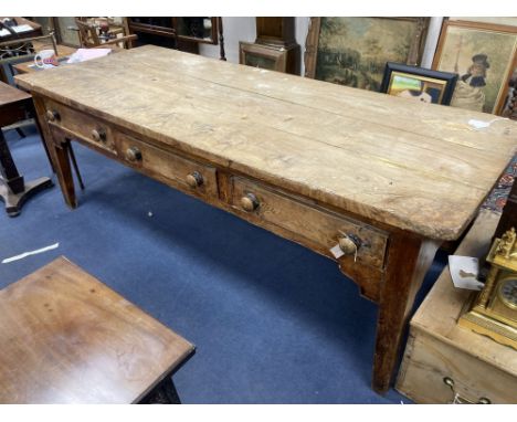 A large 19th century elm kitchen table fitted three drawers, length 227cm, width 88cm, height 80cm