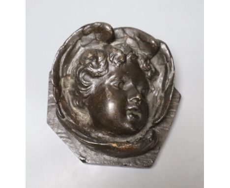 A bronze relief of a cherub, length 13cmCONDITION: Slight rubbing to lower part of wing below the chin