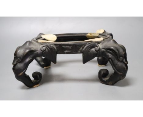 A Chinese bronze 'elephant head' stand, length 30cm