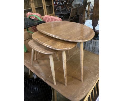 An Ercol nest of three 'Pebble' tables, width 64cm depth 42cm height 40cm