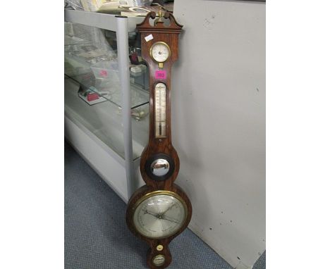 A 19th cenury rosewood cased wheel barometer with convex mirror, thermometer and dry/damp gauges, 38 high