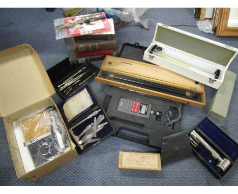 A quantity of books and tools, mainly on engineering to include a Baird and Tatlock Ltd air meter in a leather case, a micros