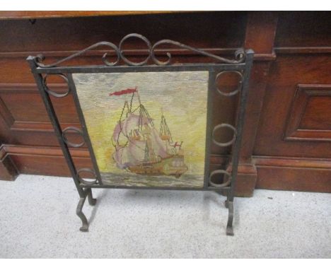 An Arts & Crafts inspired, wrought iron and tapestry fire screen, 30 h x 23 w